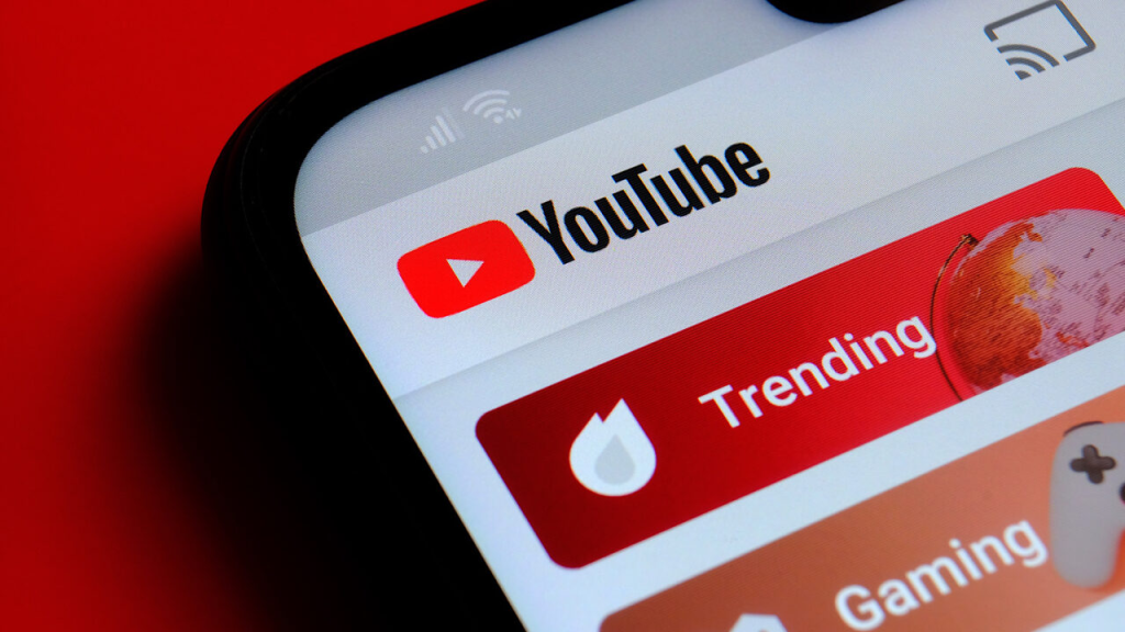 YouTube app open on a phone screen showing the Trending and Gaming tabs